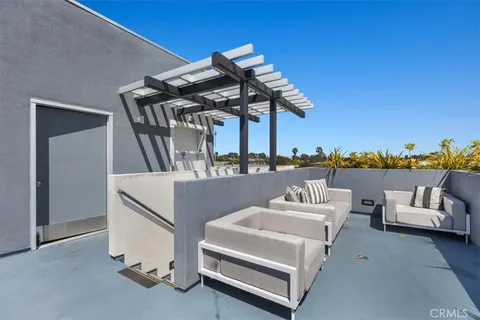 a view of a couches and a tables in the patio