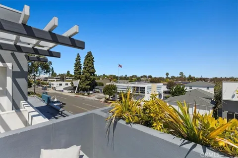 a view of a swimming pool with outdoor seating