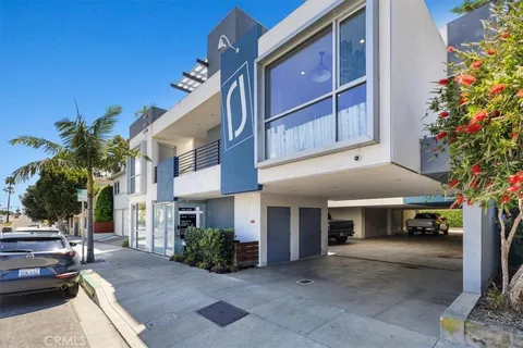a view of a car park in front of house