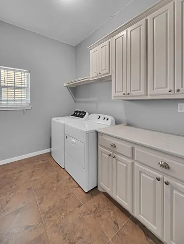 a kitchen with white cabinets
