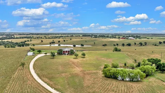a view of a swimming pool and an outdoor seating