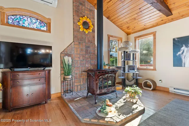 a view of a chairs on the deck in front of house