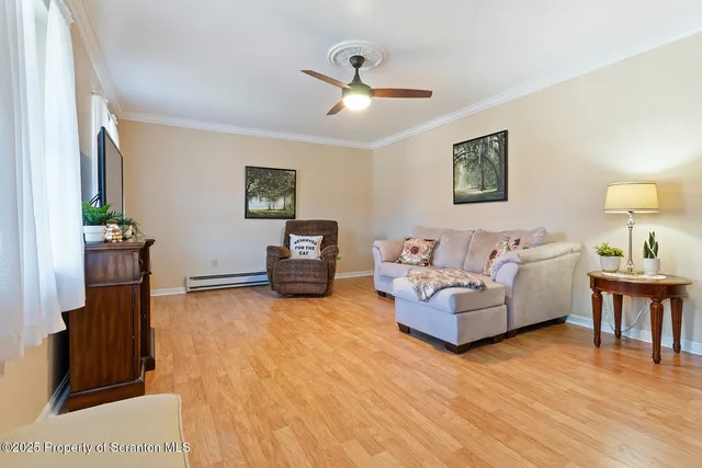 a view of a house with swimming pool and sitting area