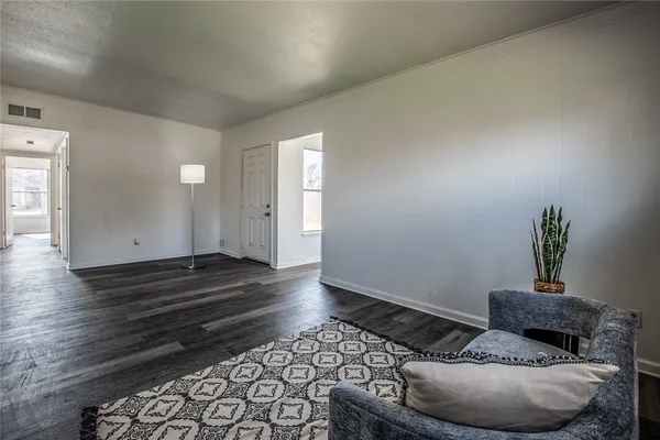a room with furniture and wooden floor
