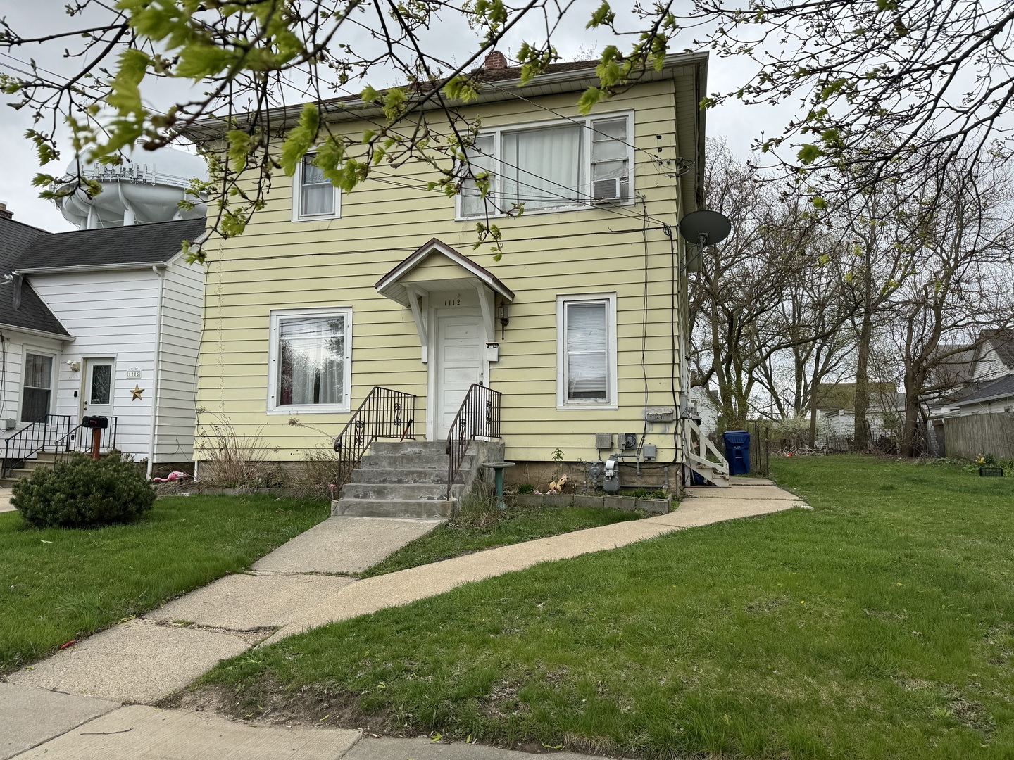 1112 Market Street DeKalb, IL 60115 - Photo 1 of 18 a front view of house with yard