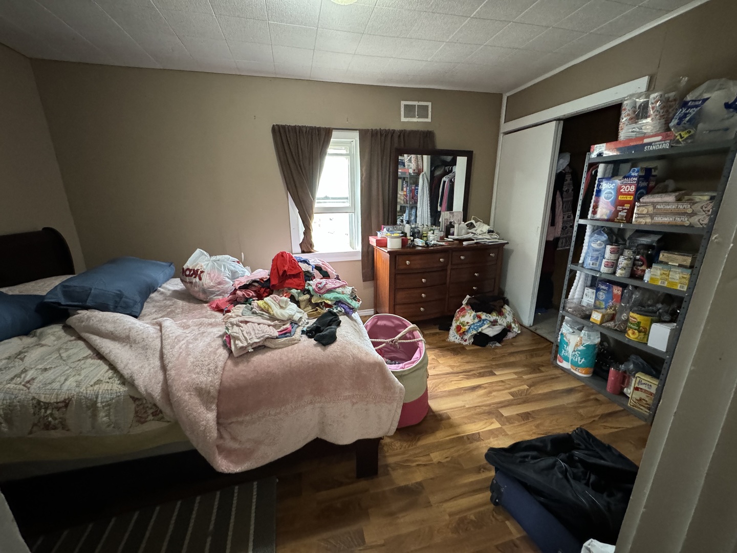 1112 Market Street DeKalb, IL 60115 - Photo 14 of 18 a bed room with bed and a window