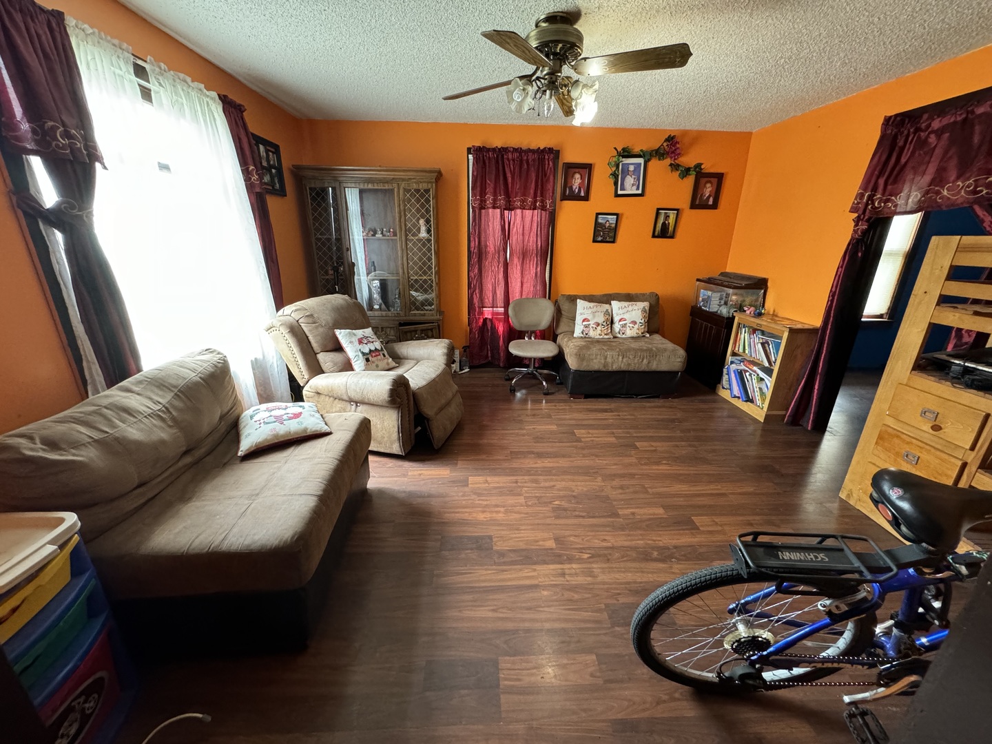1112 Market Street DeKalb, IL 60115 - Photo 2 of 18 a living room with furniture and a flat screen tv