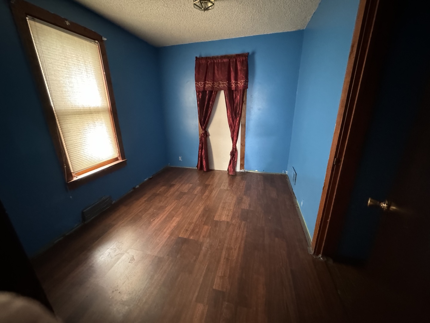 1112 Market Street DeKalb, IL 60115 - Photo 3 of 18 a view of an empty room and window