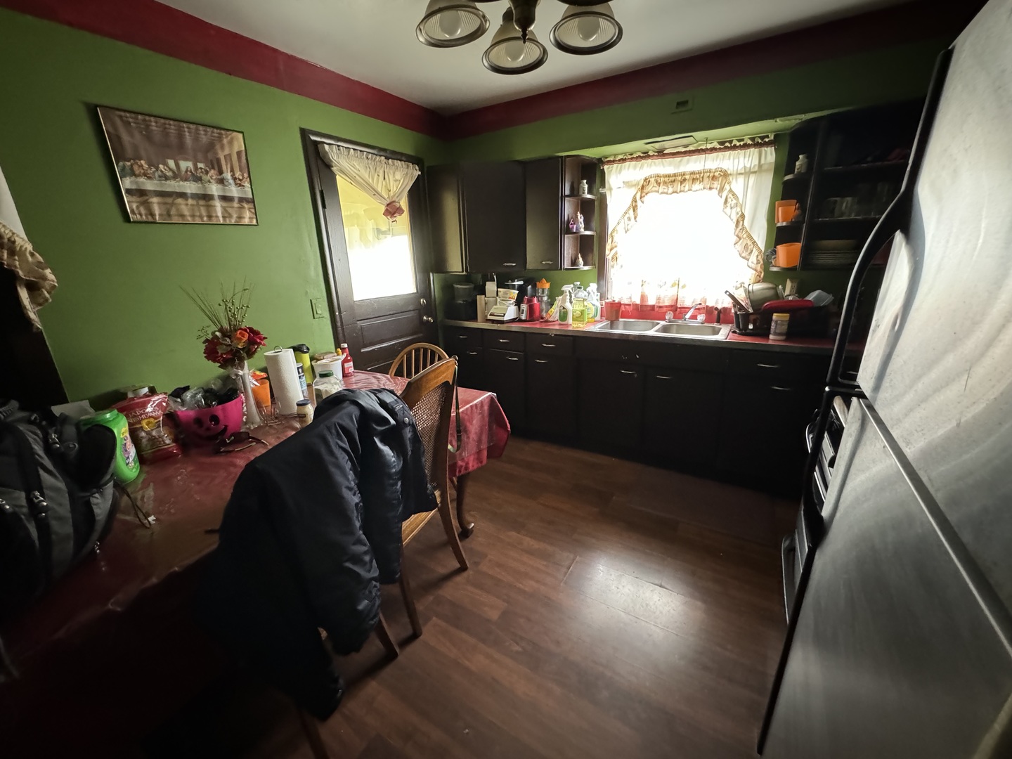 1112 Market Street DeKalb, IL 60115 - Photo 4 of 18 a living room with furniture and a large window
