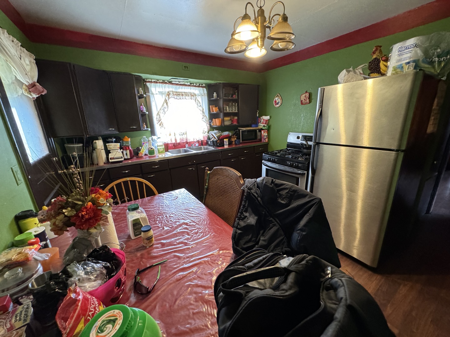 1112 Market Street DeKalb, IL 60115 - Photo 5 of 18 a kitchen with a refrigerator and a stove