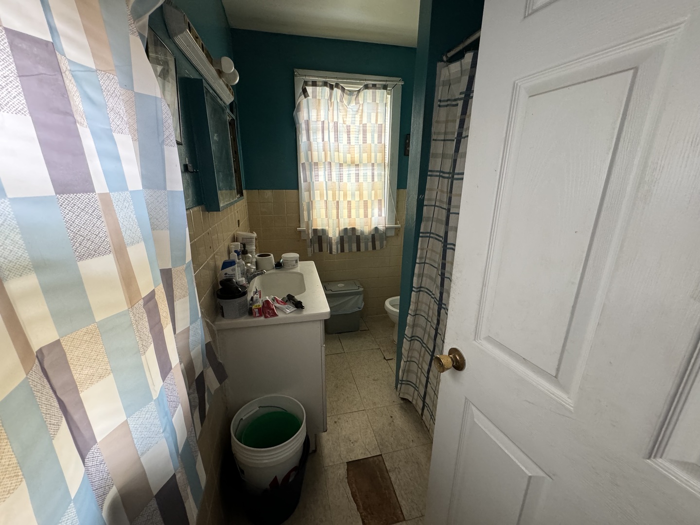1112 Market Street DeKalb, IL 60115 - Photo 7 of 18 a living room with furniture and a toilet