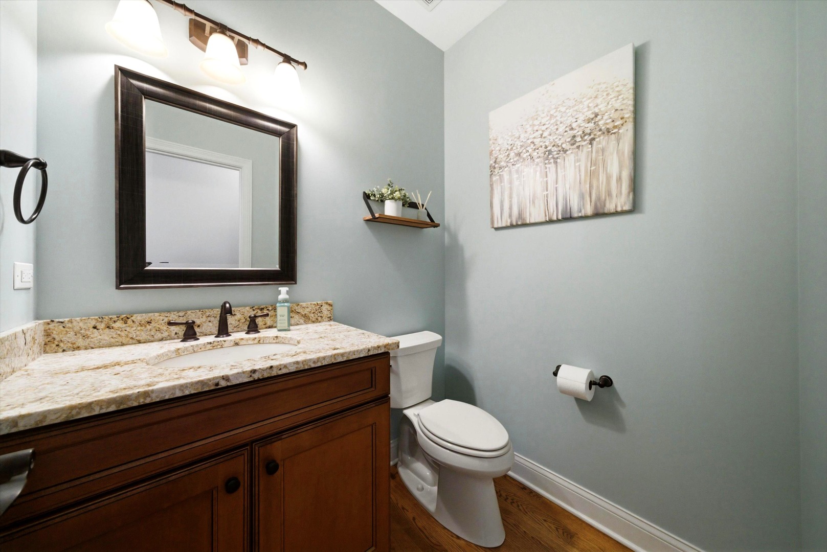 2061 Windham Circle Wheaton, IL 60187 - Photo 12 of 35 a bathroom with a toilet sink vanity and mirror