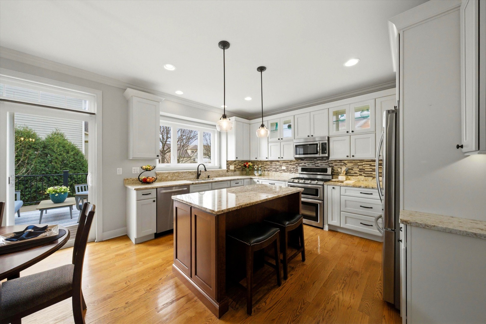 2061 Windham Circle Wheaton, IL 60187 - Photo 5 of 35 a kitchen with cabinets wooden floor and a counter top space