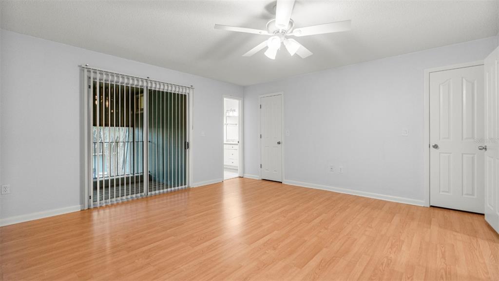 501 Southwest 75th Street, Unit B5 Gainesville, FL 32607 - Photo 15 of 38 wooden floor in an empty room with a window