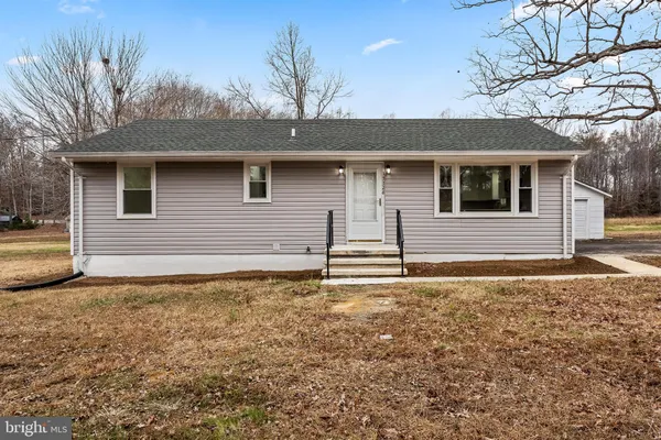 a house with trees in the background