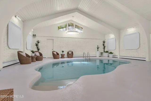 a view of a living room and kitchen