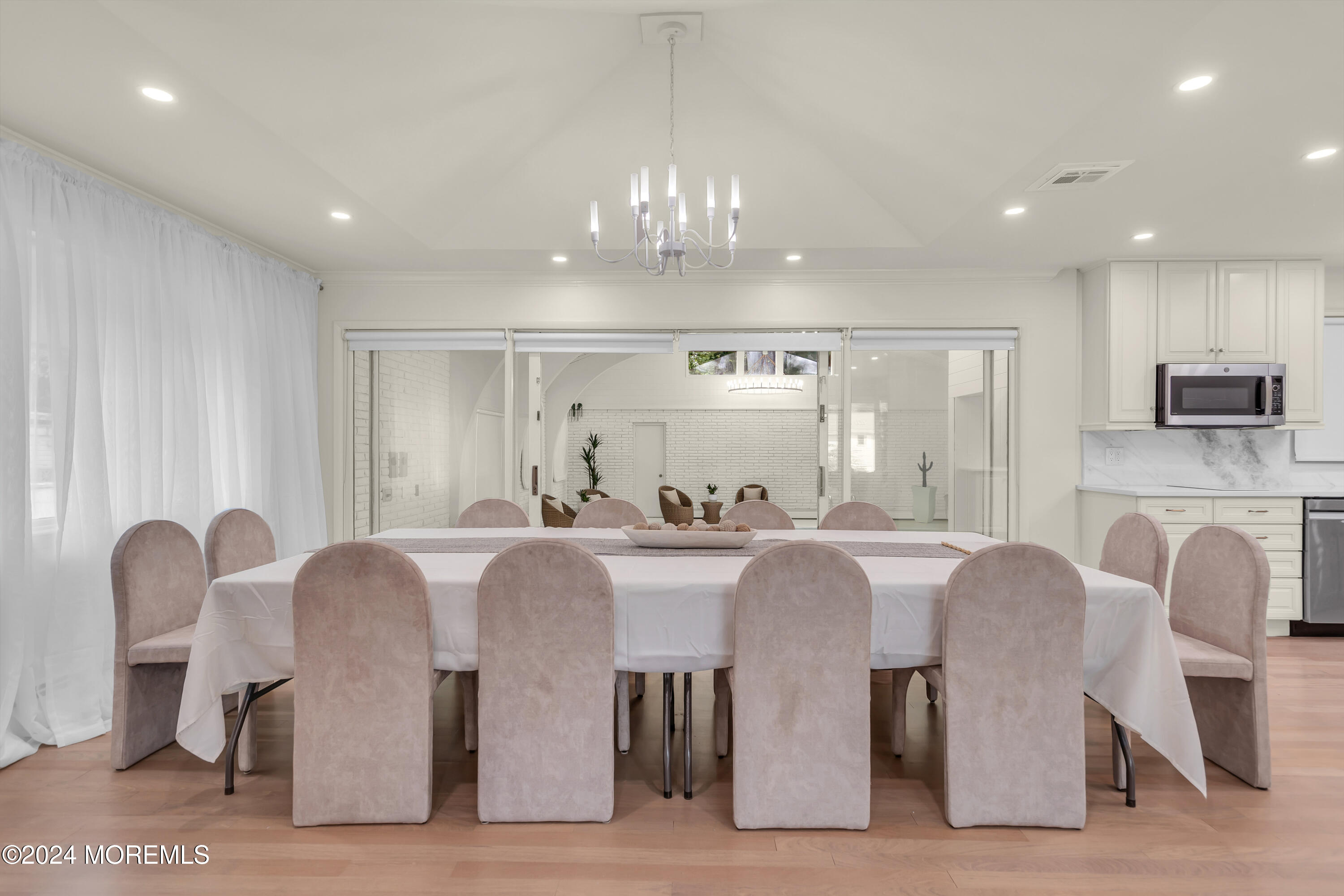 7 Lakeview Drive Jackson, NJ 08527 - Photo 14 of 67 a large kitchen with stainless steel appliances granite countertop a dining table chairs and a refrigerator