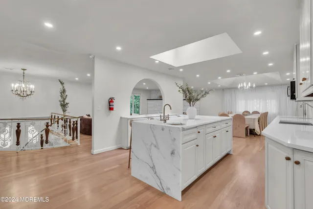 a spacious bedroom with a bed and a window