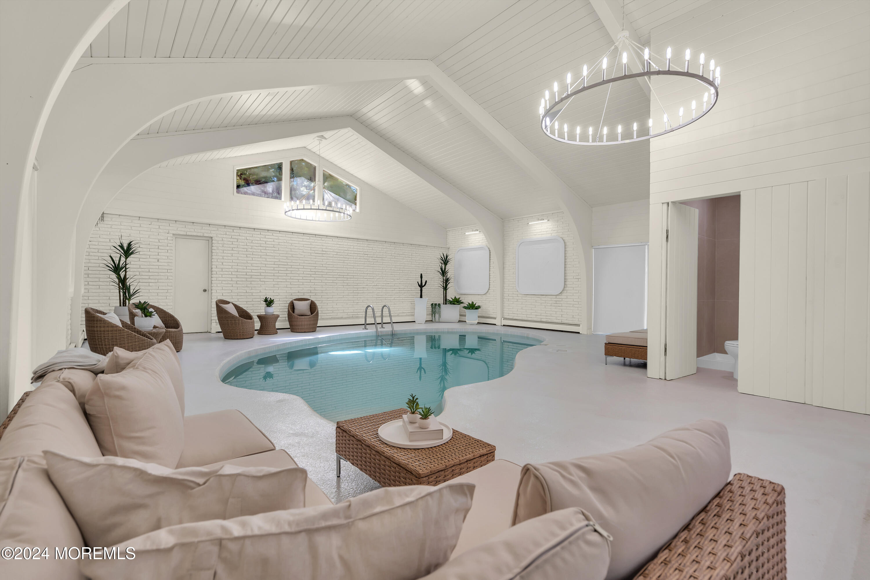 7 Lakeview Drive Jackson, NJ 08527 - Photo 36 of 67 a living room with furniture and a chandelier