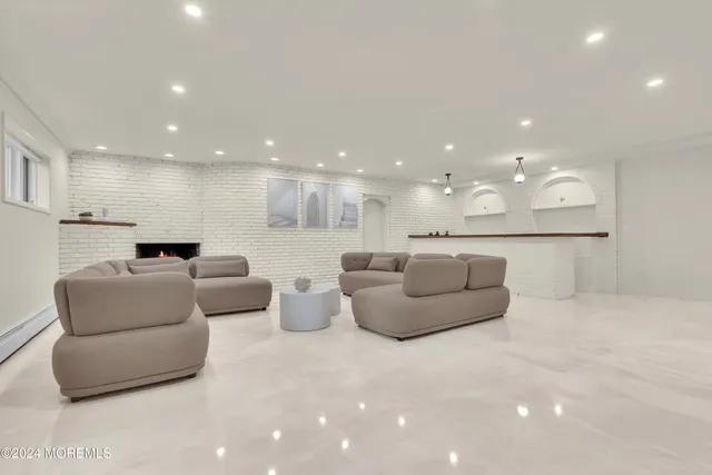 a view of a backyard with potted plants and large tree