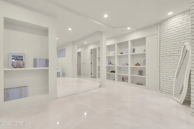 a view of a lush green forest with trees and some houses