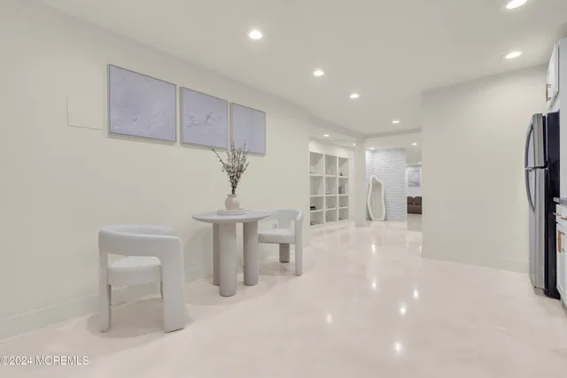 a front view of house with a garden and trees