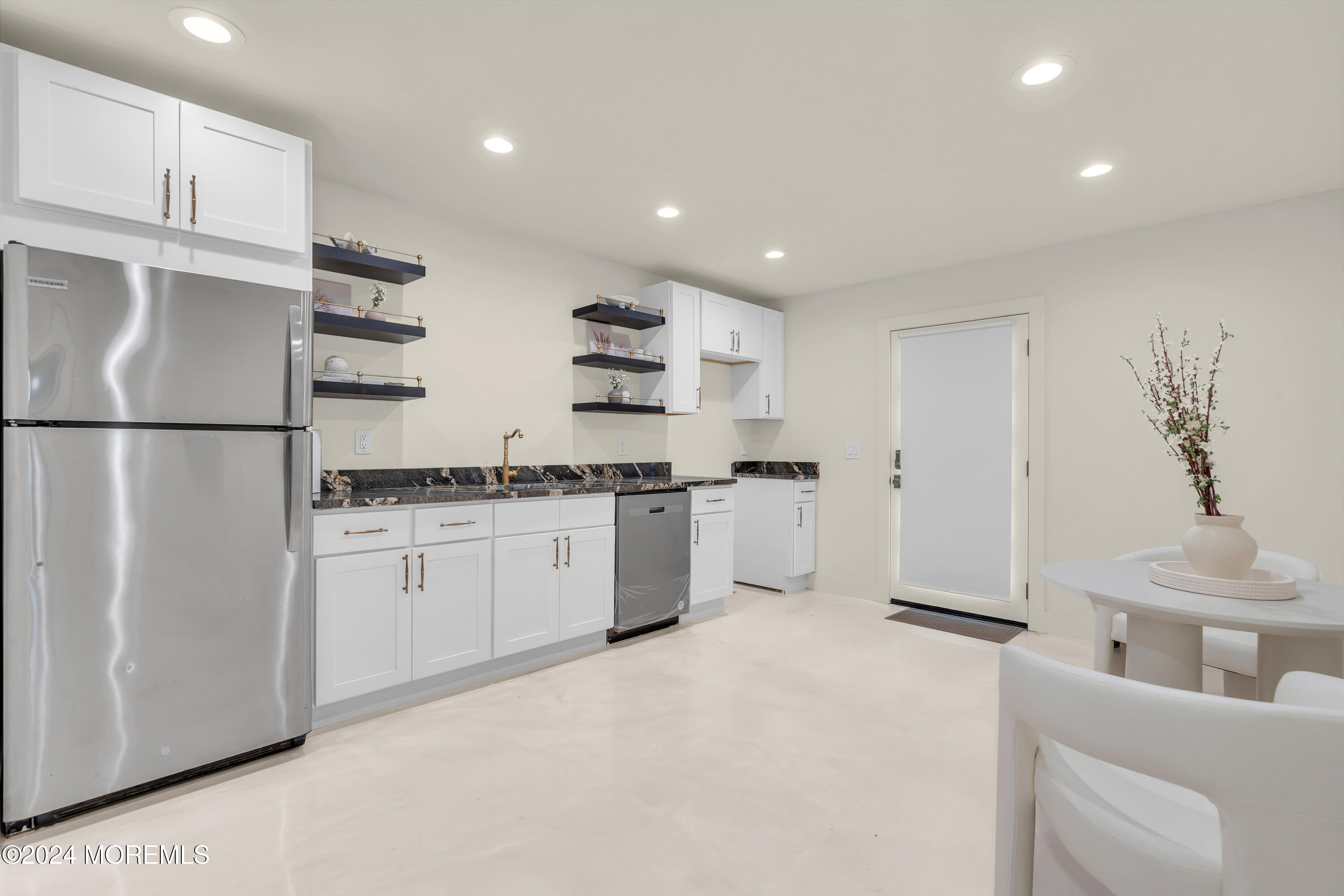 7 Lakeview Drive Jackson, NJ 08527 - Photo 51 of 67 a kitchen with white cabinets and white appliances