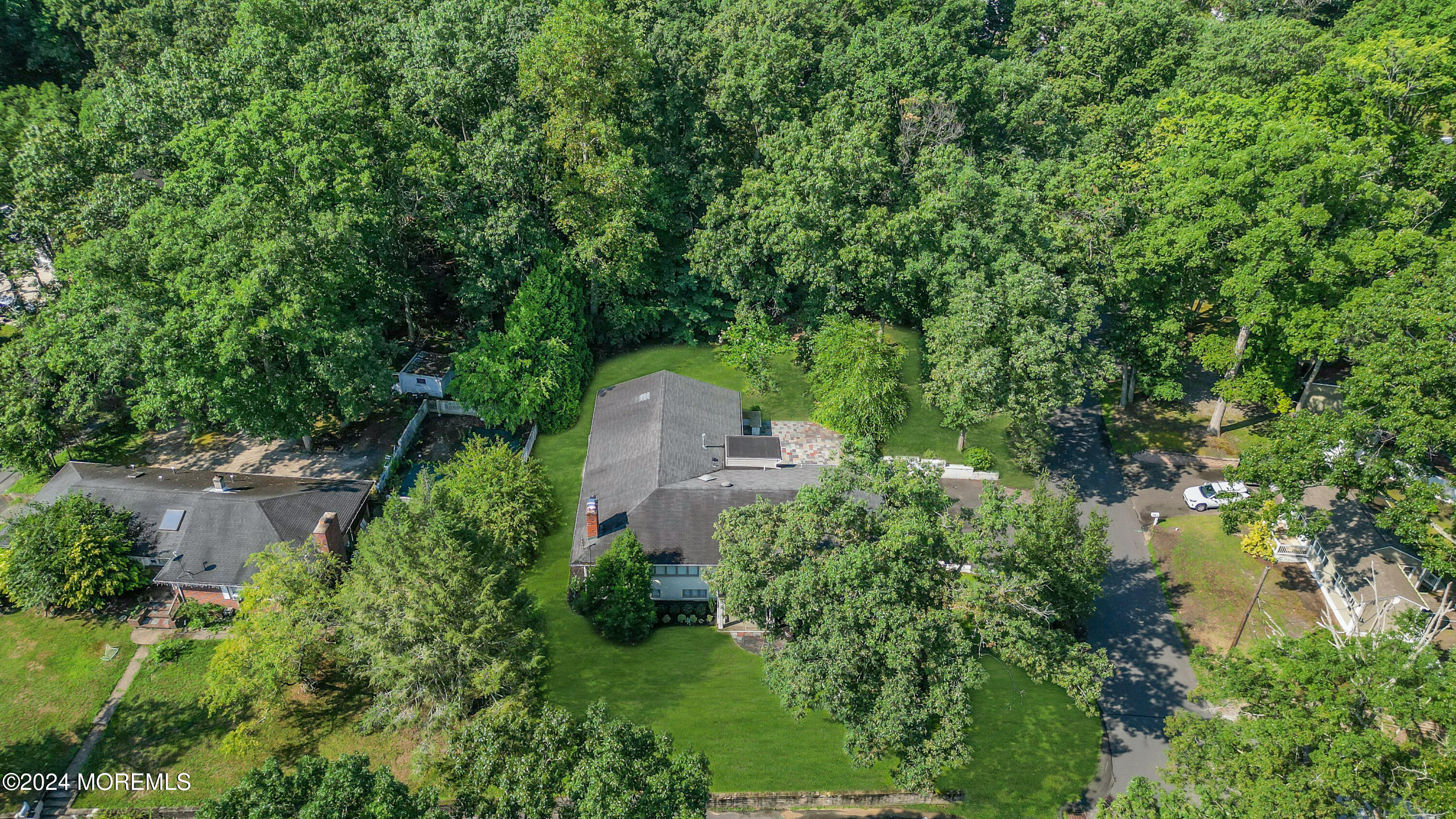 7 Lakeview Drive Jackson, NJ 08527 - Photo 63 of 67 an aerial view of a house with a yard and large trees