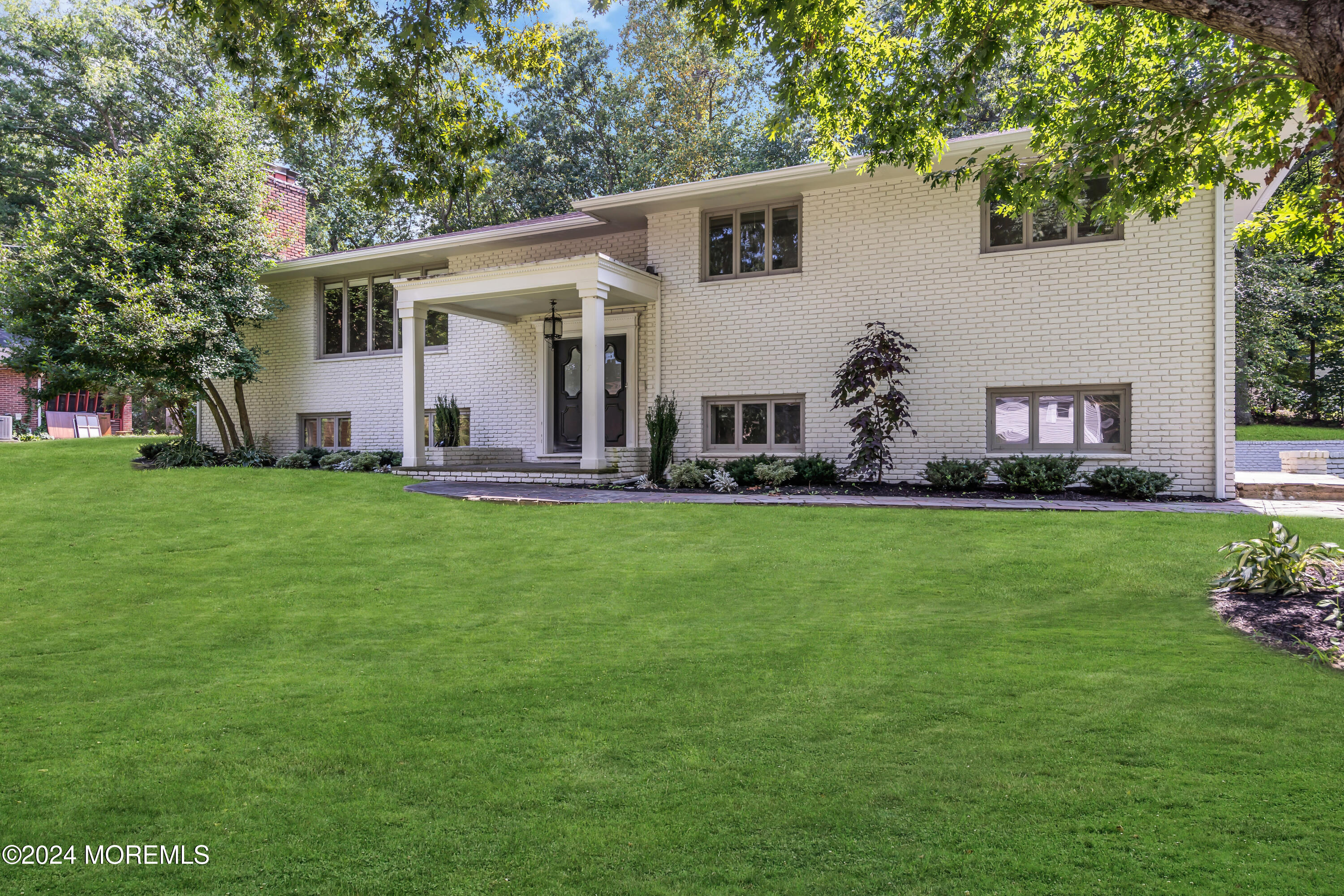 7 Lakeview Drive Jackson, NJ 08527 - Photo 67 of 67 a front view of house with a garden and trees