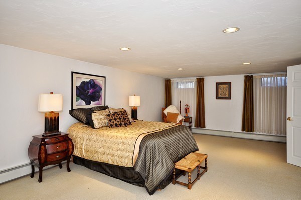 20 Deerhaven Road Lincoln, MA 01773 - Photo 16 of 25 a bedroom with a bed and wooden floor