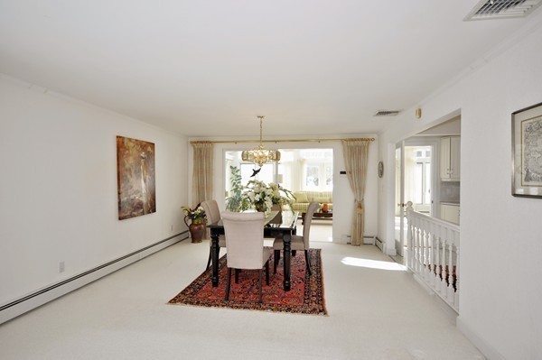 20 Deerhaven Road Lincoln, MA 01773 - Photo 6 of 25 a dining room with furniture a chandelier and wooden floor