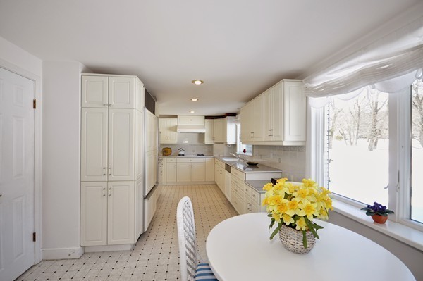 20 Deerhaven Road Lincoln, MA 01773 - Photo 7 of 25 a living room with stainless steel appliances furniture a rug and a kitchen view