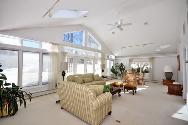 20 Deerhaven Road Lincoln, MA 01773 - Photo 10 of 25 a living room with furniture and a large window