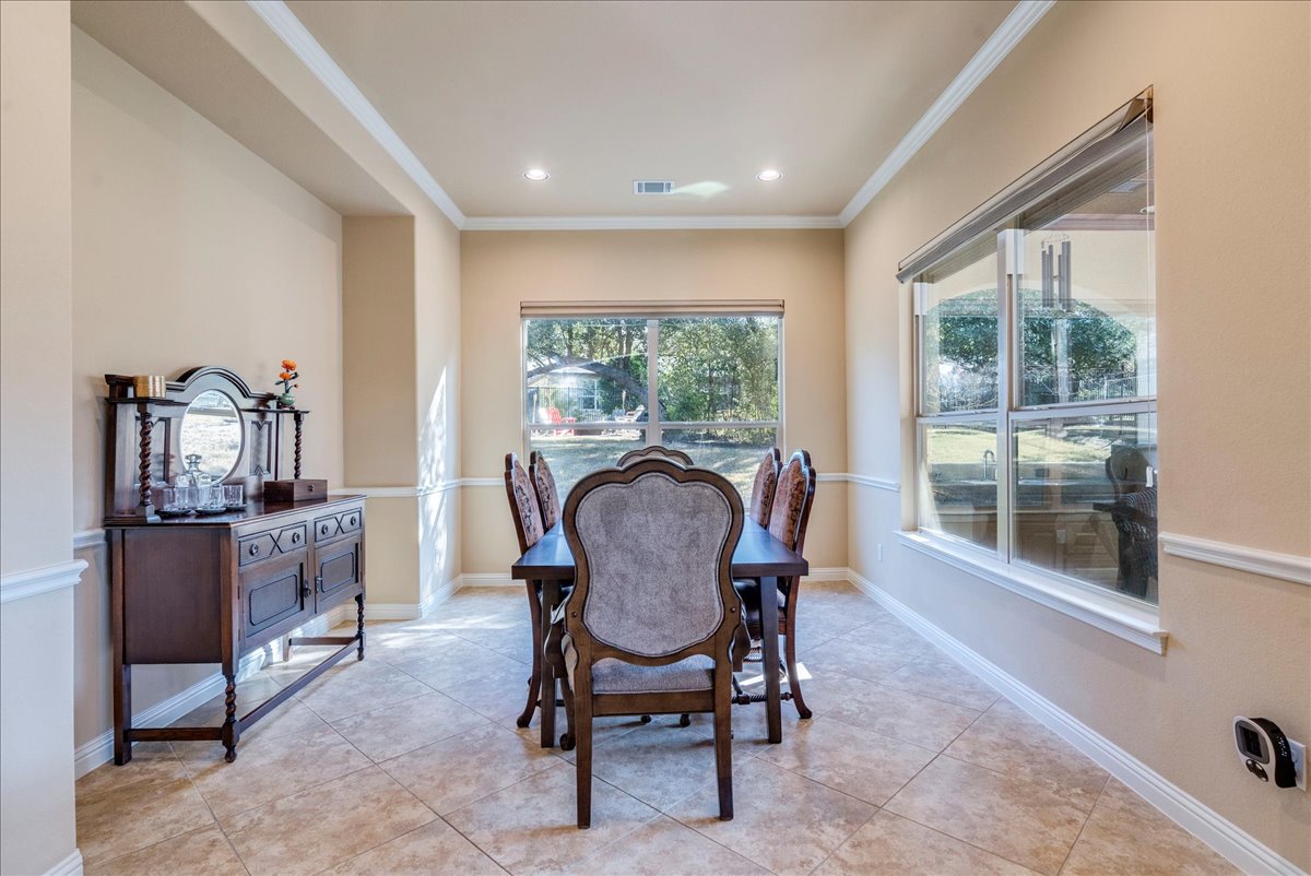 307 Duffy Lane Austin, TX 78738 - Photo 11 of 40 a view of a dining room with furniture window and outside view
