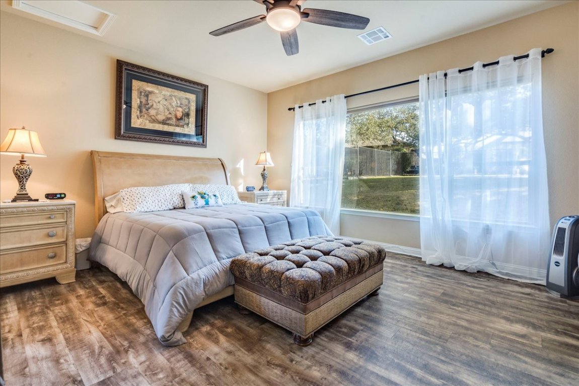 307 Duffy Lane Austin, TX 78738 - Photo 12 of 40 Substantial primary suite offers panoramic views of the backyard & ample room to make this retreat your own. 307 Duffy Ln Austin TX 78738 MLS#4418396