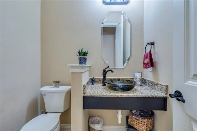 a bathroom with a toilet and a sink