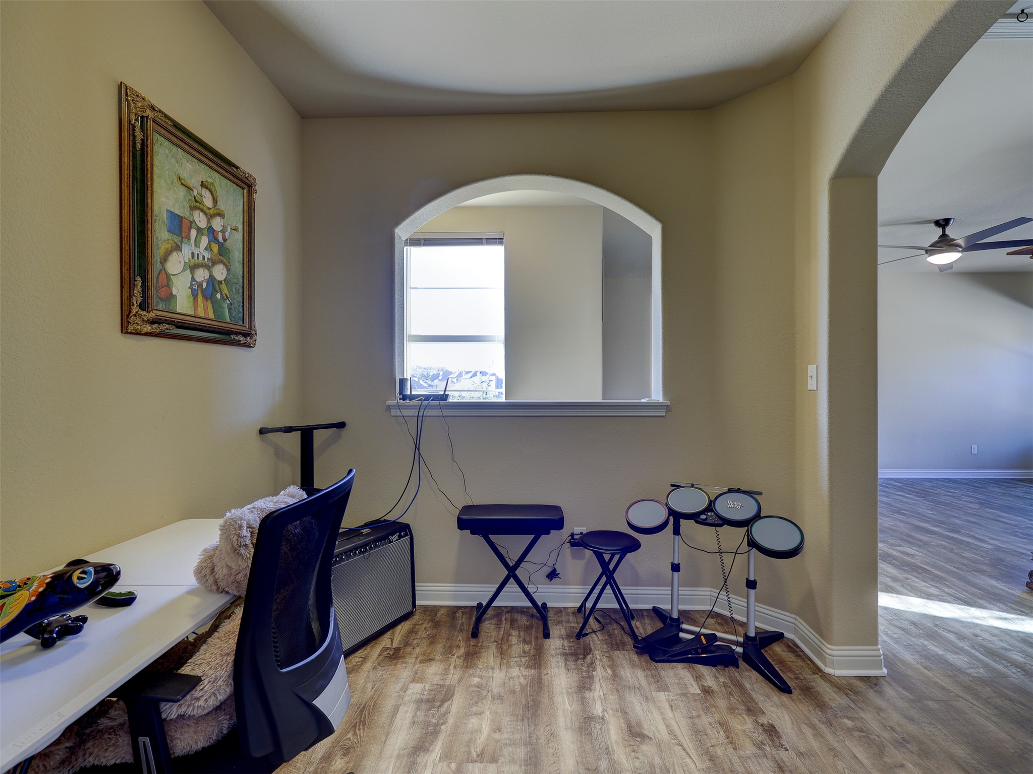 307 Duffy Lane Austin, TX 78738 - Photo 18 of 40 a workspace with furniture and wooden floor