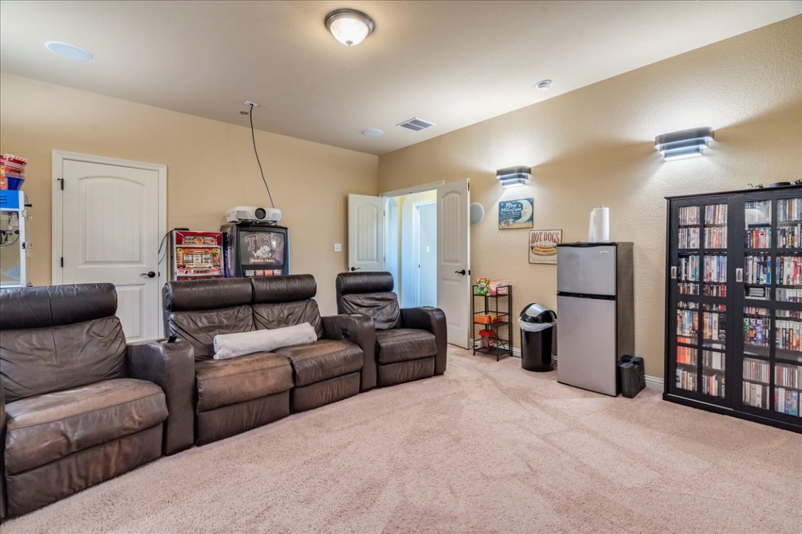 307 Duffy Lane Austin, TX 78738 - Photo 26 of 40 Cinema with carpet floors and a textured wall