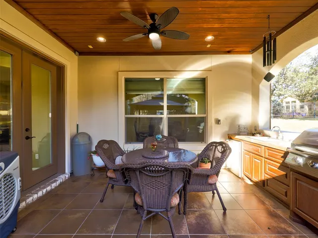a outdoor dining space with furniture and outdoor view