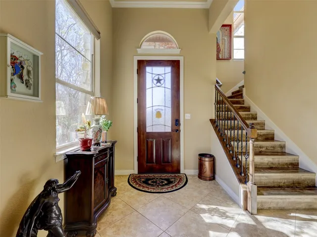 a view of a workspace with furniture and entryway