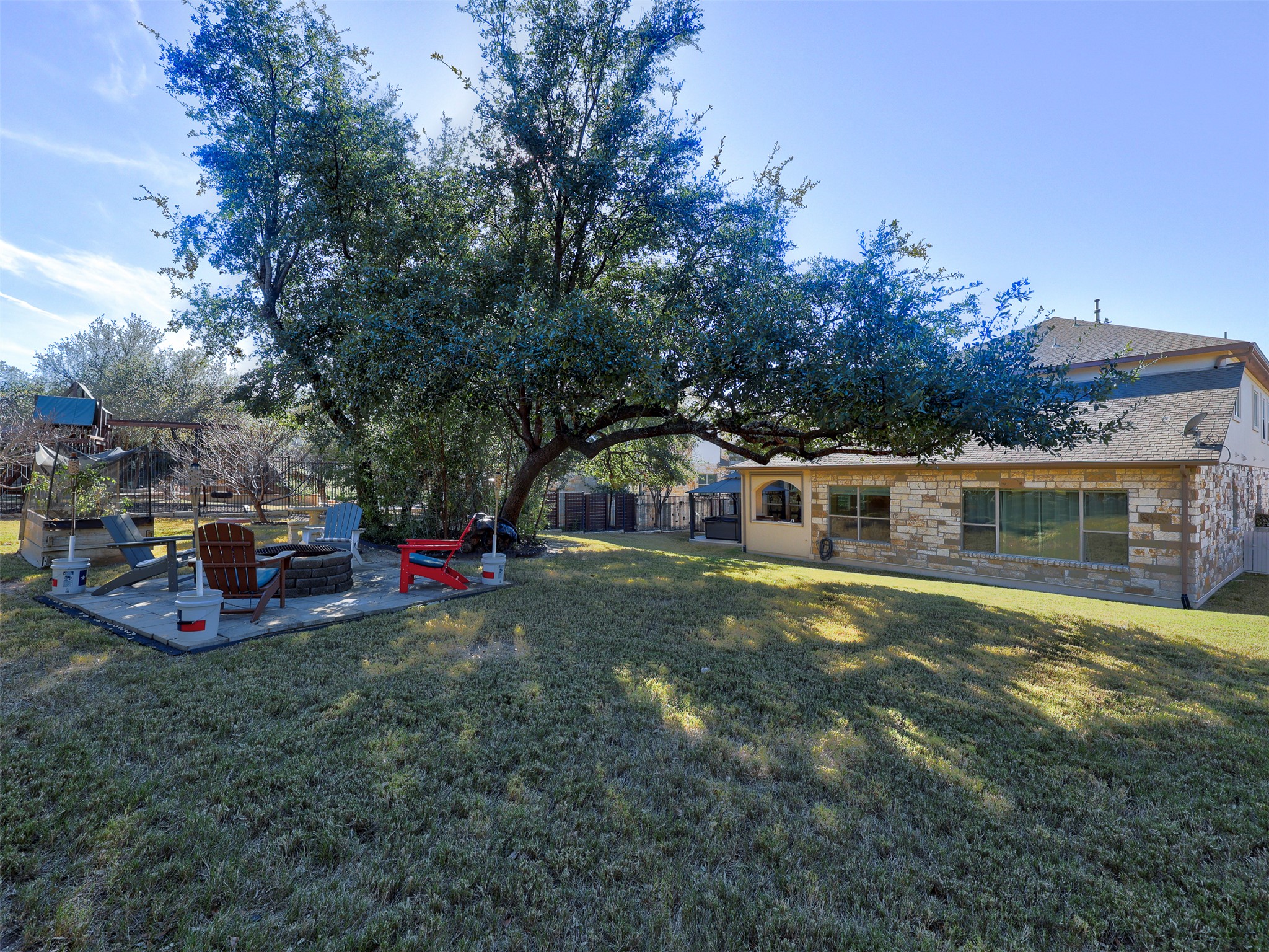 307 Duffy Lane Austin, TX 78738 - Photo 35 of 40 a view of a house with a big yard and large trees