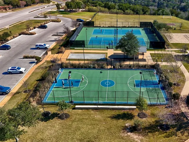 an aerial view of residential houses and outdoor space