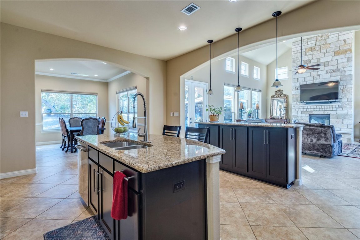 307 Duffy Lane Austin, TX 78738 - Photo 9 of 40 Kitchen, looking towards the formal dining, living & the truly stunning backyard. 307 Duffy Ln Austin TX 78738 MLS#4418396