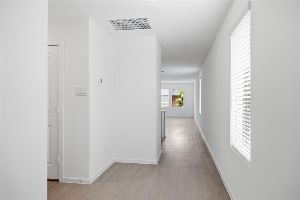2128 Doc Holliday Road Joshua, TX 76058 - Photo 5 of 28 Entry hallway featuring light wood-finish flooring and crisp white walls