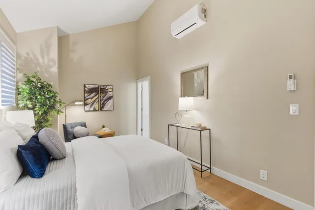 a bedroom with a bed and a couch