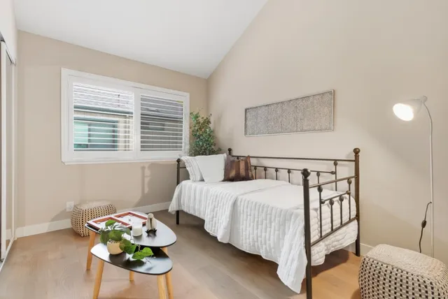 a bedroom with bed and a window