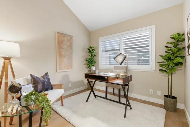 a view of a livingroom with furniture and window