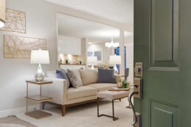 a living room with furniture and a lamp