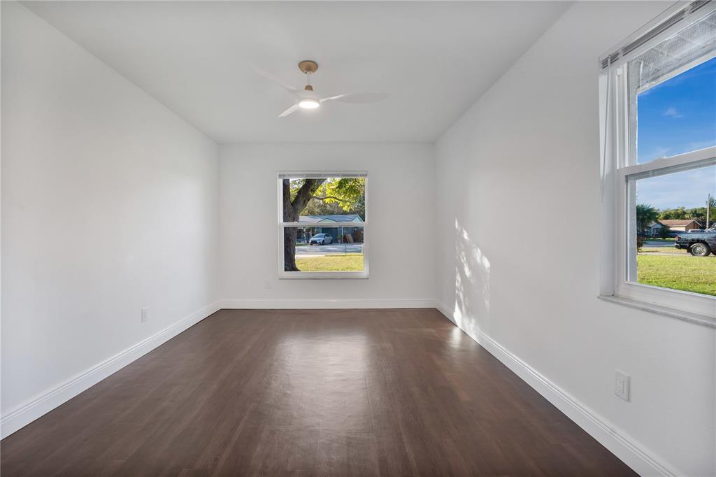 1213 Baranova Road Ocoee, FL 34761 - Photo 20 of 31 wooden floor in an empty room with a window