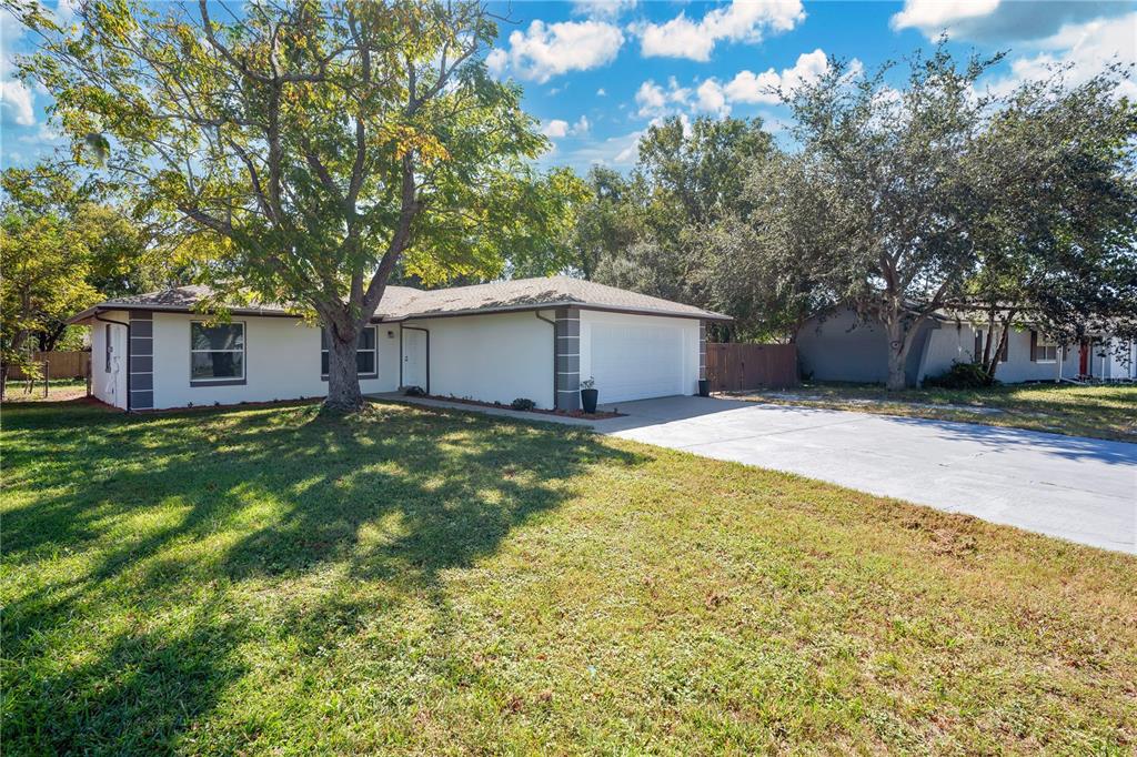 1213 Baranova Road Ocoee, FL 34761 - Photo 2 of 31 a house view with a garden space